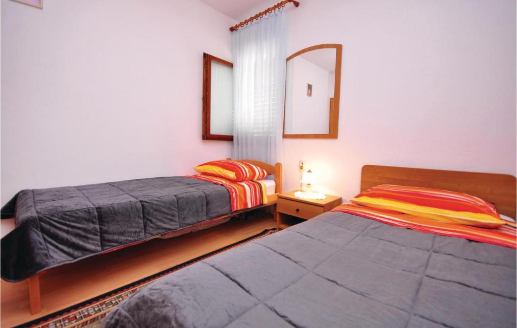 Postel nebo postele na pokoji v ubytování Holiday Home Gata Ostrvica