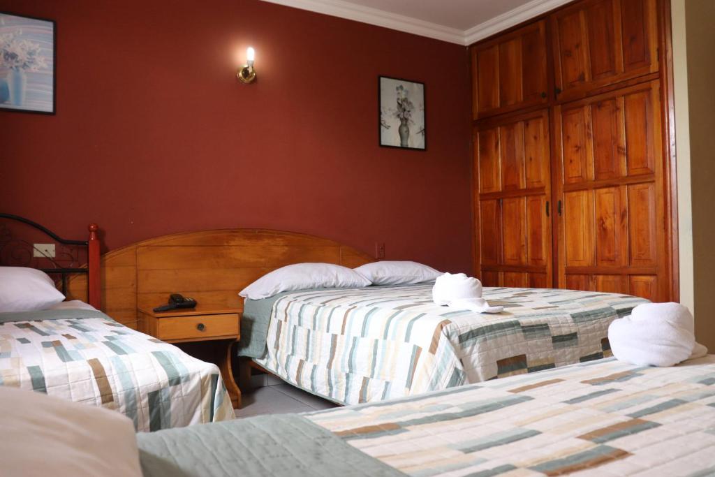 Postel nebo postele na pokoji v ubytování Hotel Toledo