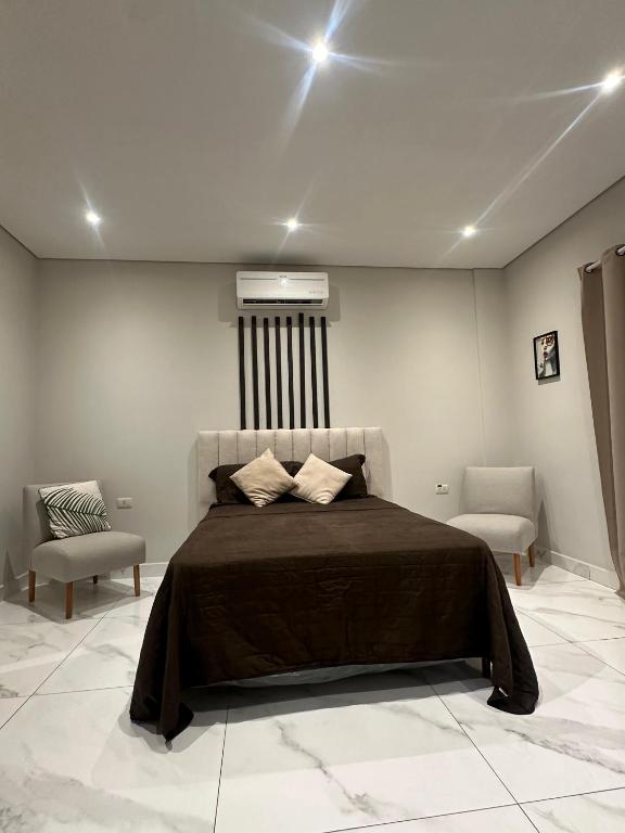 Voodi või voodid majutusasutuse Habitaciones con Baño toas