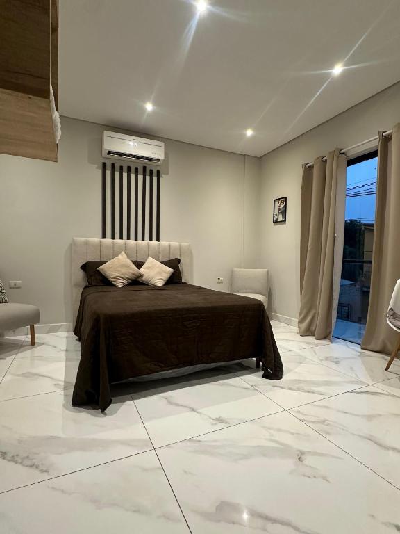 Voodi või voodid majutusasutuse Habitaciones con Baño toas