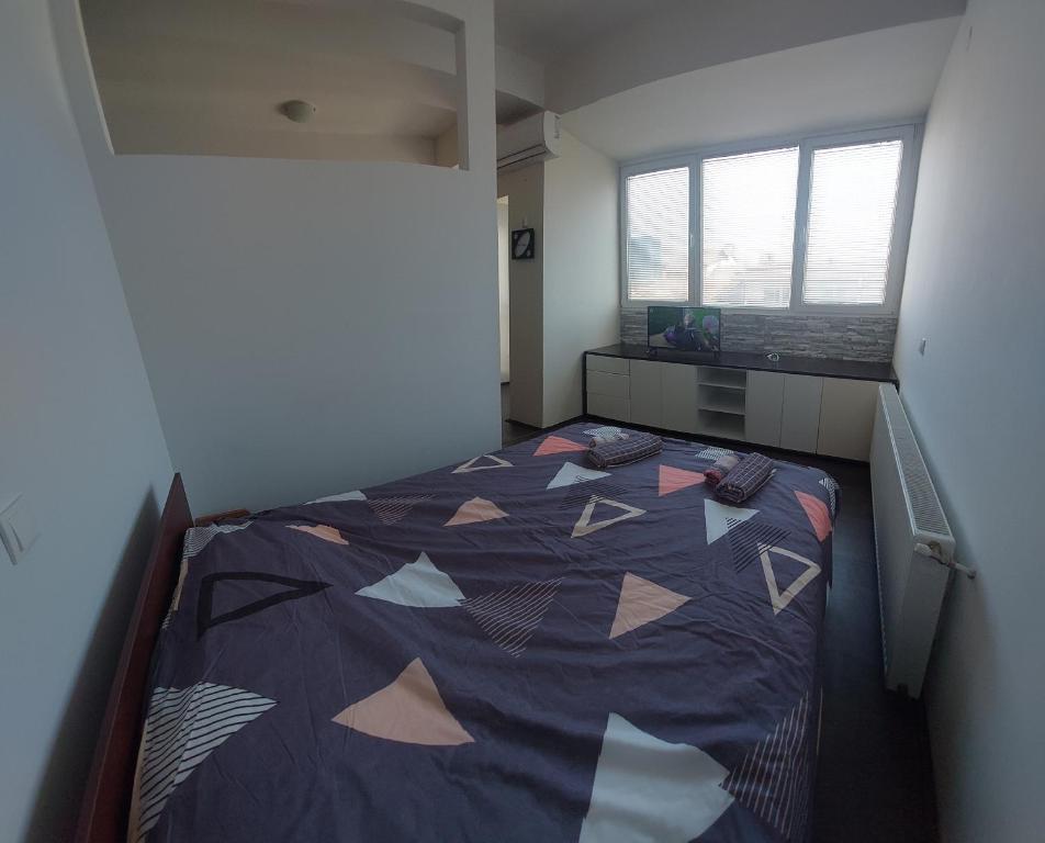 Postel nebo postele na pokoji v ubytování Apartmani Kuzman