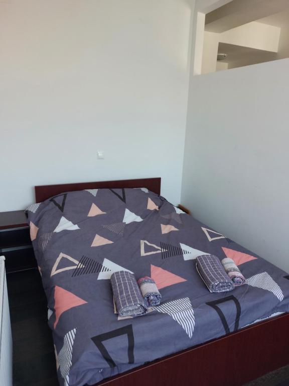 Postel nebo postele na pokoji v ubytování Apartmani Kuzman