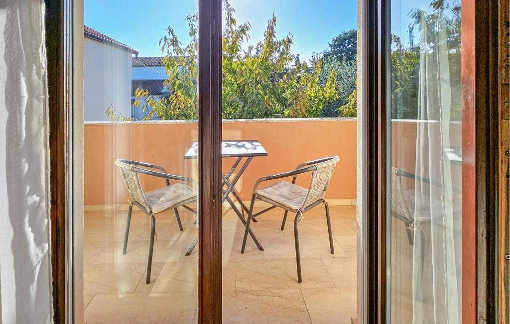 Balkón alebo terasa v ubytovaní Four-Bedroom Holiday Home In Vrsi