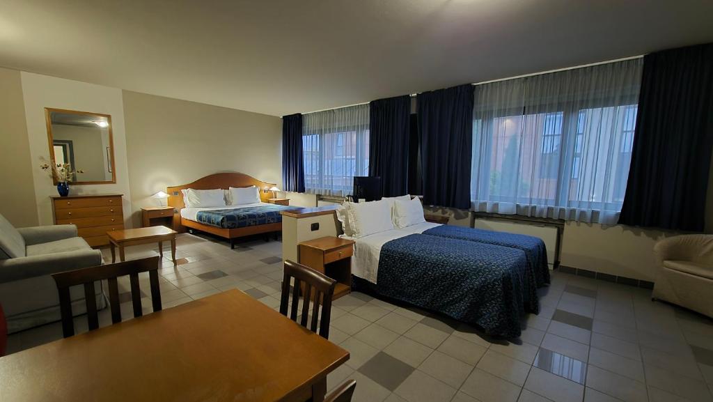 Postel nebo postele na pokoji v ubytování Hotel Le Cerbaie