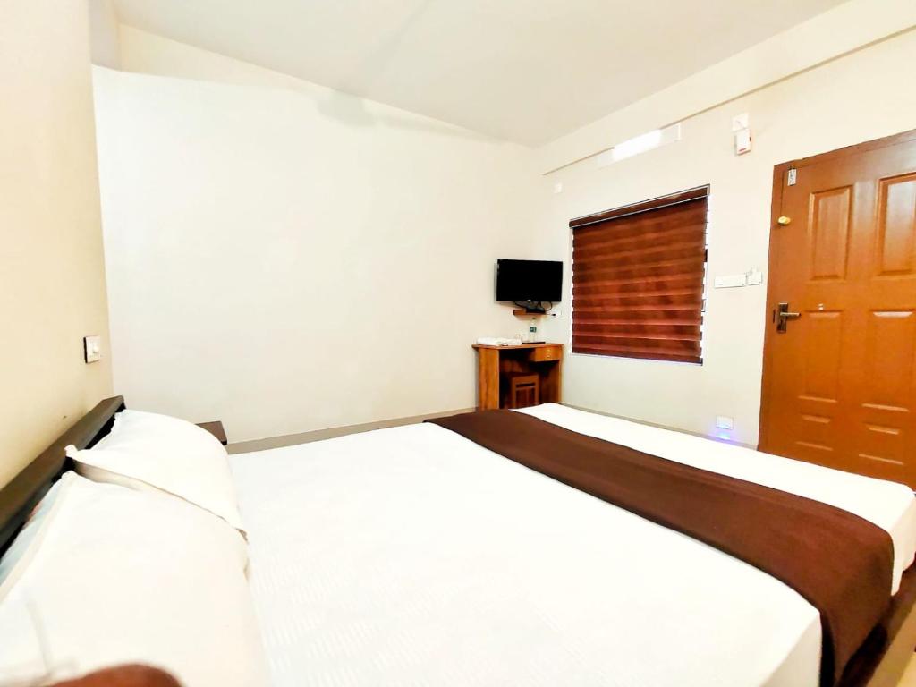 Postel nebo postele na pokoji v ubytování Mizzle Resort