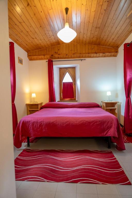 Postel nebo postele na pokoji v ubytování Camere vecchio borgo