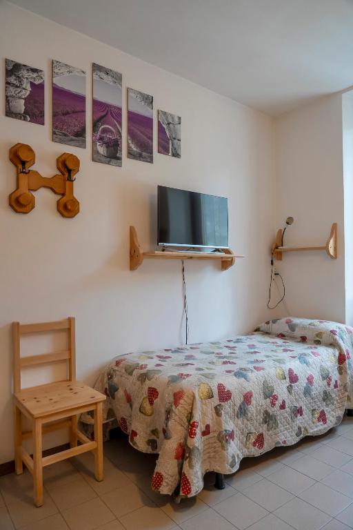 Postel nebo postele na pokoji v ubytování Camere vecchio borgo