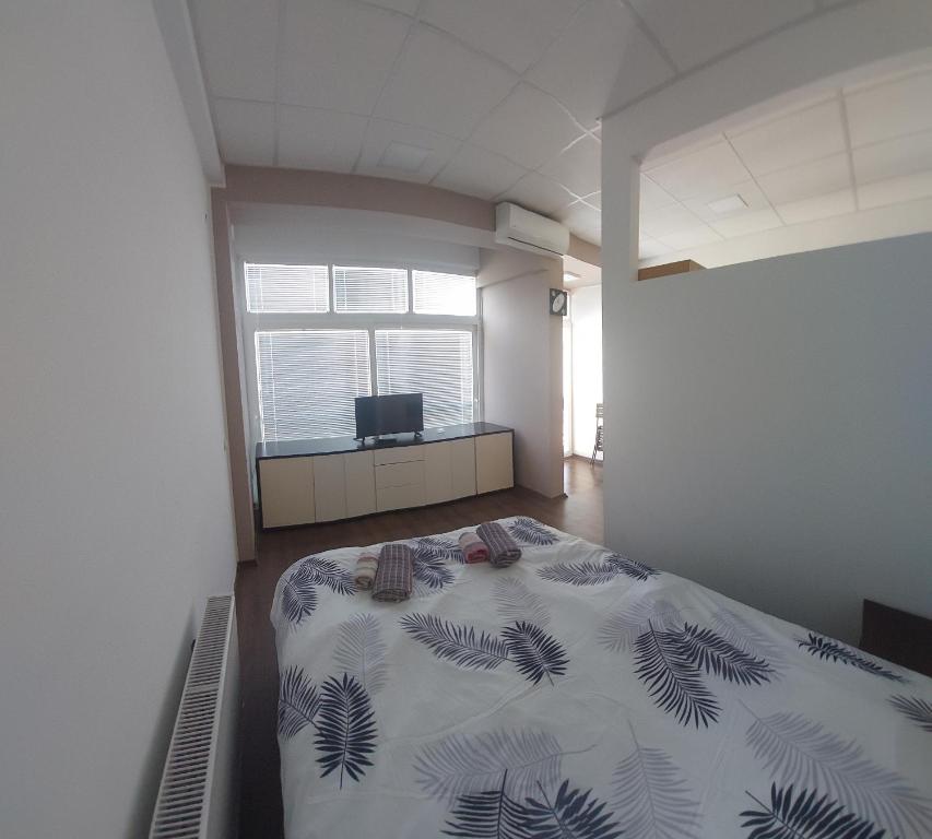 Postel nebo postele na pokoji v ubytování Apartmani Kuzman