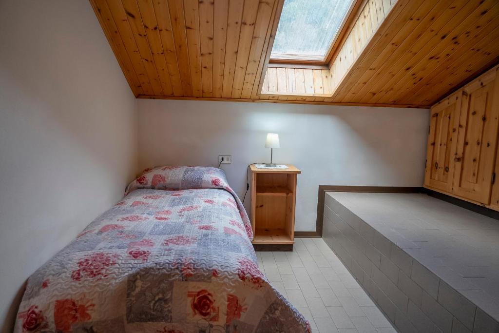 Postel nebo postele na pokoji v ubytování Camere vecchio borgo