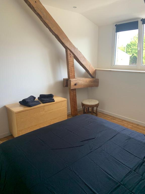 Posteľ alebo postele v izbe v ubytovaní Maison proche Mont Saint Michel