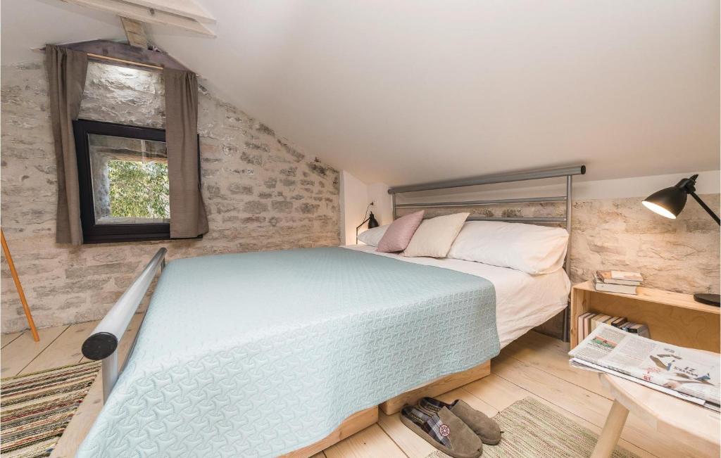 Posteľ alebo postele v izbe v ubytovaní Two-Bedroom Holiday Home In Pridraga