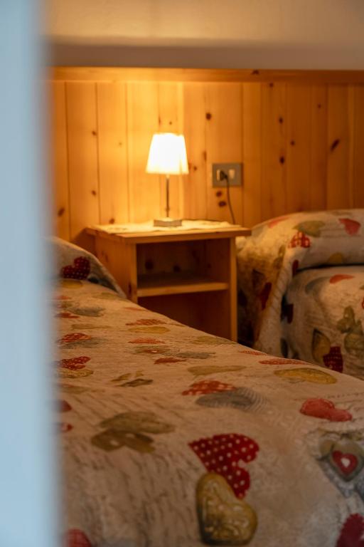 Postel nebo postele na pokoji v ubytování Camere vecchio borgo