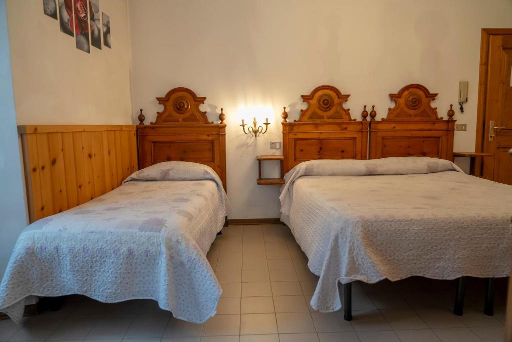 Postel nebo postele na pokoji v ubytování Camere vecchio borgo