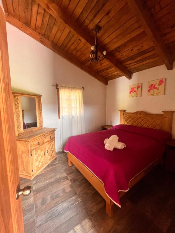 Postel nebo postele na pokoji v ubytování Cabañas Cumbres de Aguacatitla