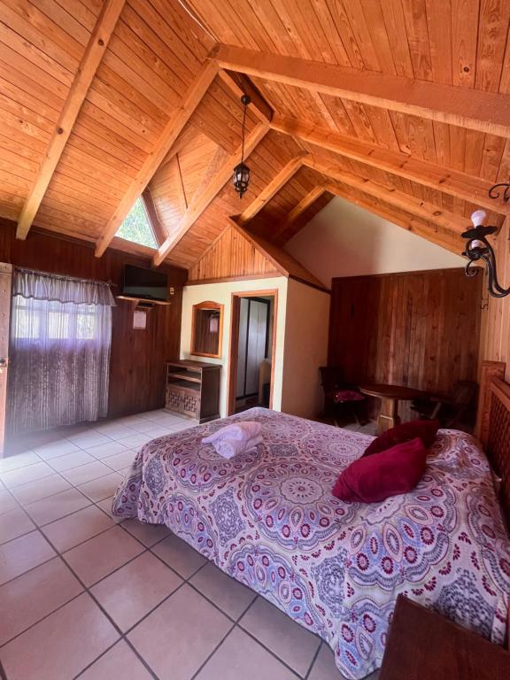 Postel nebo postele na pokoji v ubytování Cabañas Cumbres de Aguacatitla