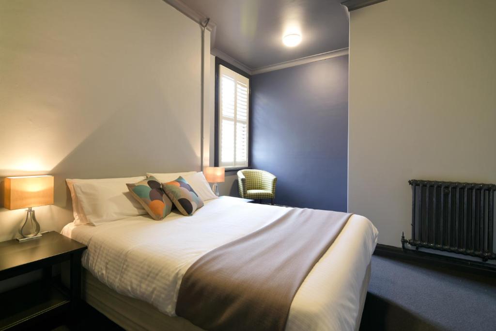 Postel nebo postele na pokoji v ubytování Hotel Canobolas
