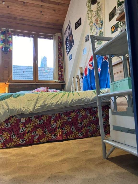 Postel nebo postele na pokoji v ubytování Chambre Océanie en Alsace