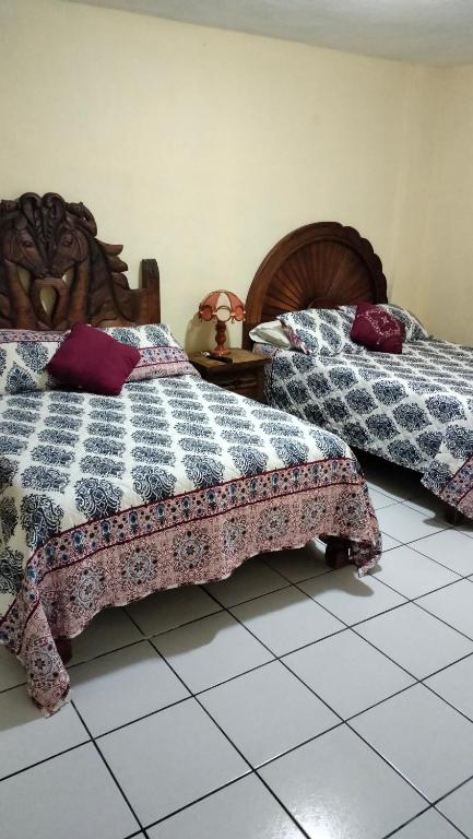 Postel nebo postele na pokoji v ubytování Hotel Chely