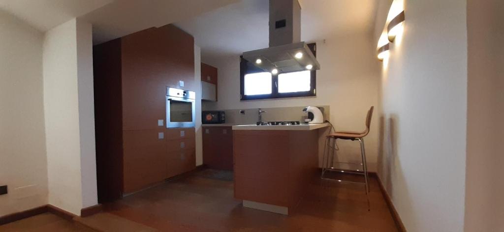 a small kitchen with a sink and a window at Casa Bella Apartment in San Giovanni Rotondo