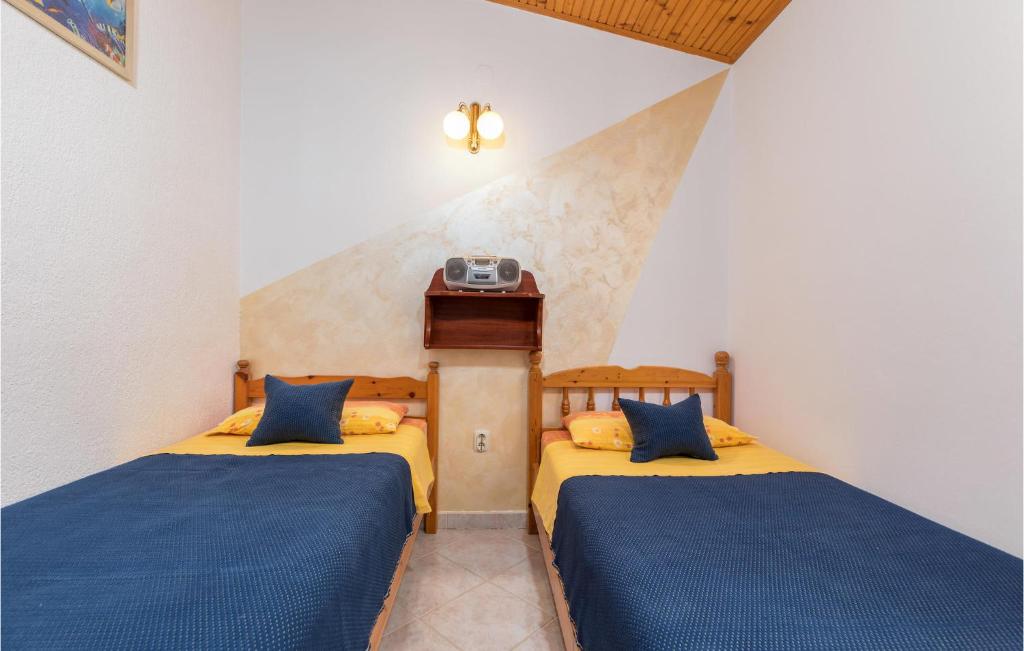 Postel nebo postele na pokoji v ubytování Holiday Home Fazana 22
