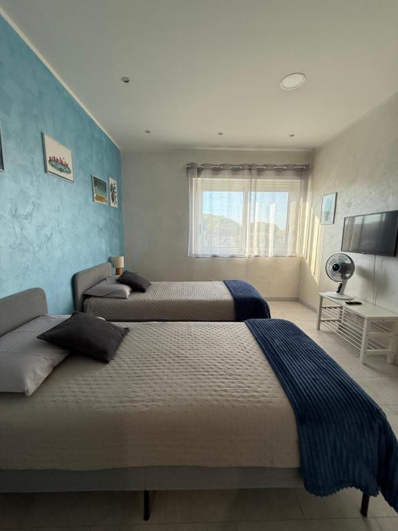 Un pat sau paturi într-o cameră la Appartamento con Terrazza