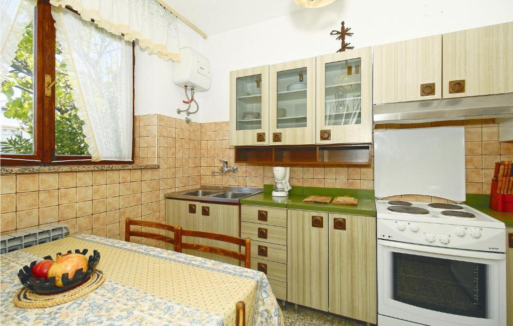 Kuchyňa alebo kuchynka v ubytovaní Apartment V,c,emina Vi
