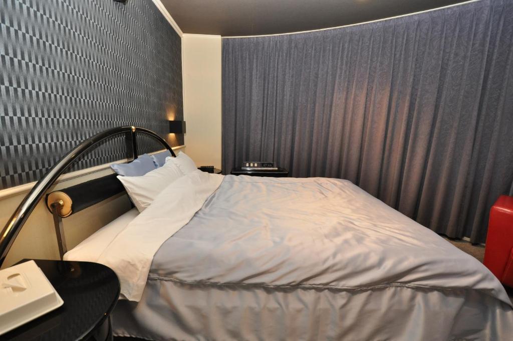 Postel nebo postele na pokoji v ubytování Hotel Boston Club (Adult Only)