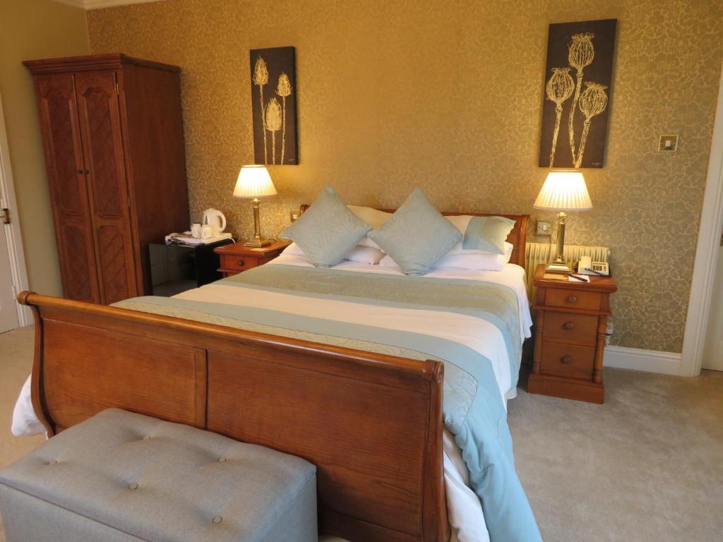 Postel nebo postele na pokoji v ubytování Brook Manor Lodge