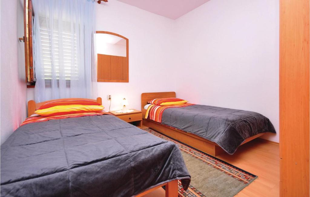 Postel nebo postele na pokoji v ubytování Holiday Home Gata Ostrvica