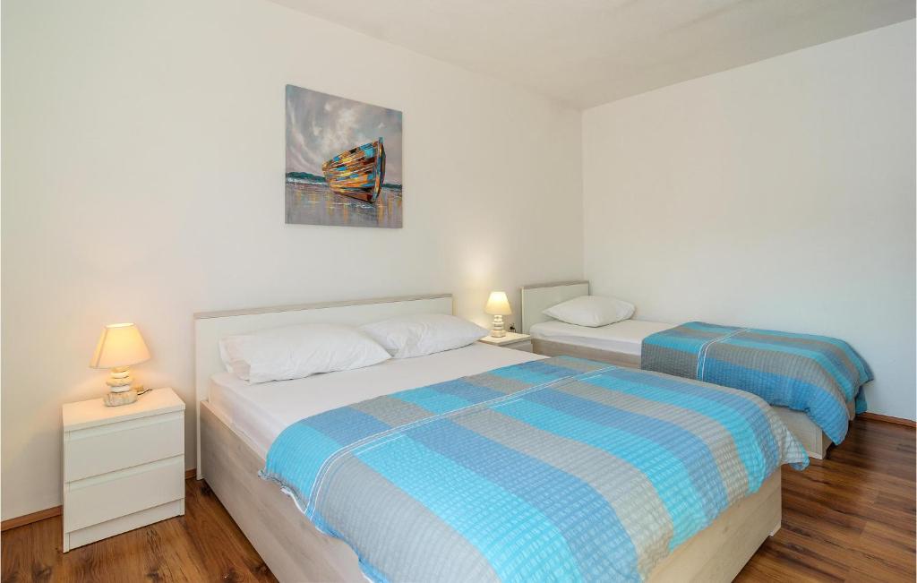 Posteľ alebo postele v izbe v ubytovaní Two-Bedroom Holiday Home In Zastrazisce