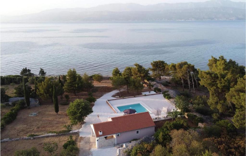 an aerial view of a house with a swimming pool at Lovely Home In Supetar in Supetar