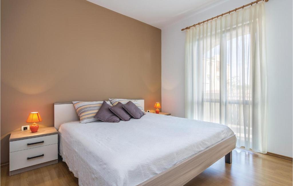 Łóżko lub łóżka w pokoju w obiekcie Apartment Porec 05