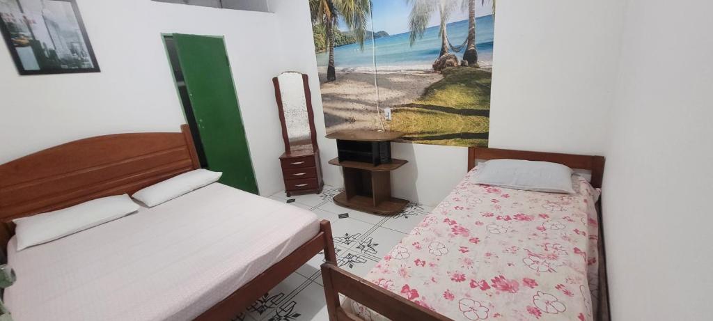 Postel nebo postele na pokoji v ubytování Recanto do Mar