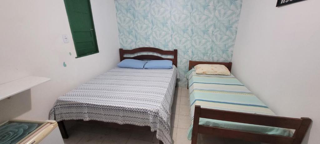Postel nebo postele na pokoji v ubytování Recanto do Mar