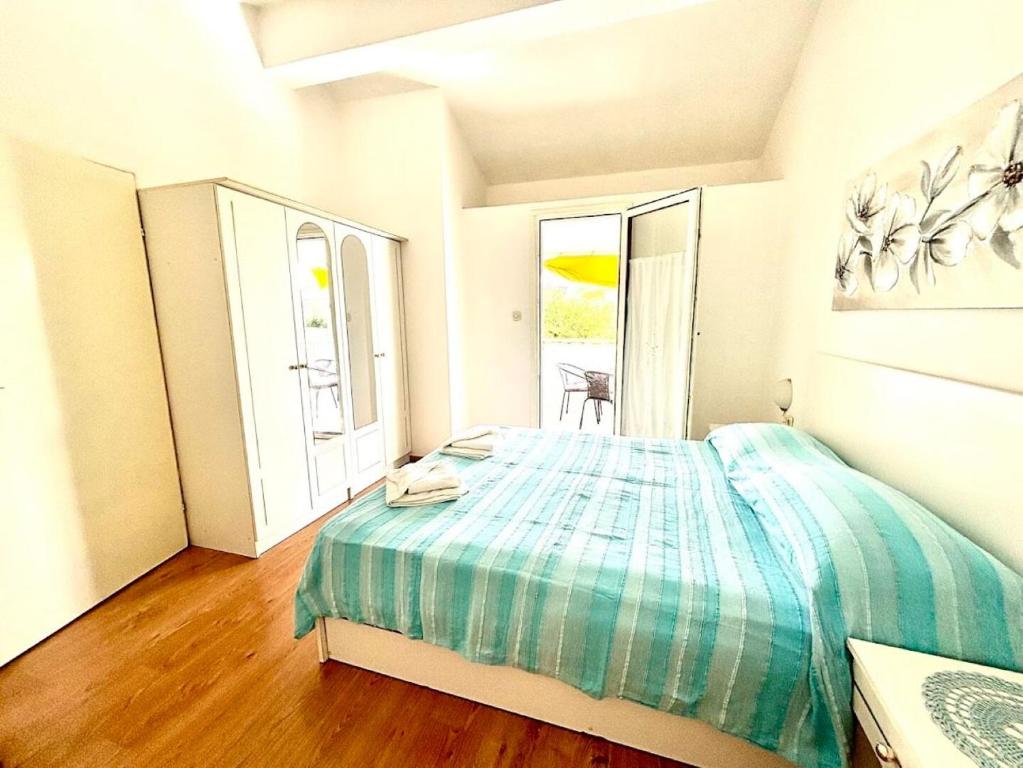 Posteľ alebo postele v izbe v ubytovaní Apartments Let
