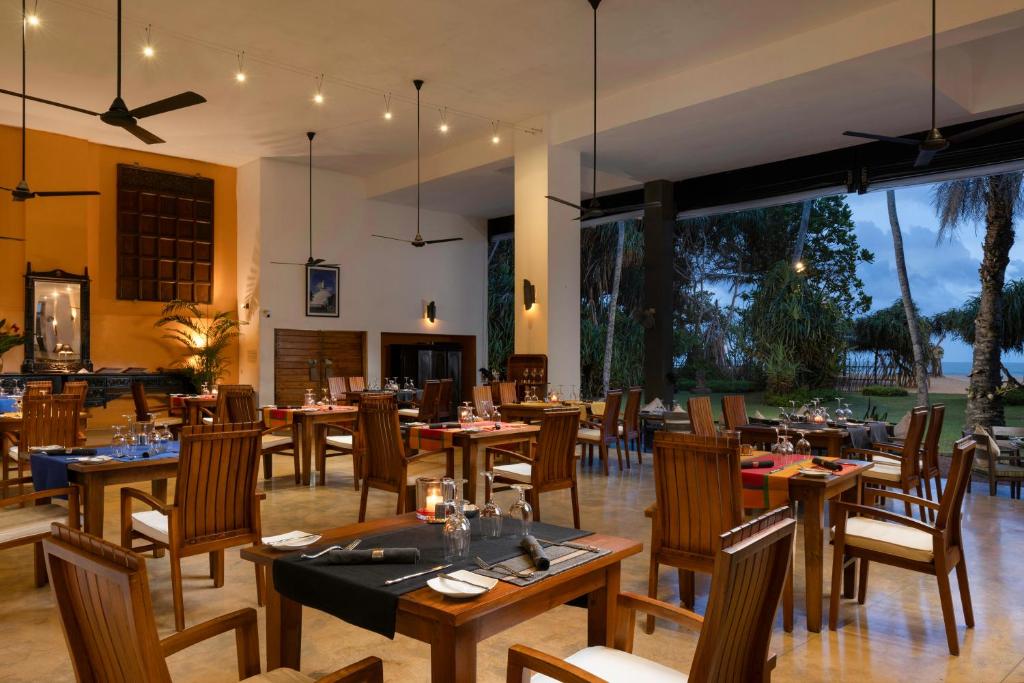 A restaurant or other place to eat at Aditya Resort