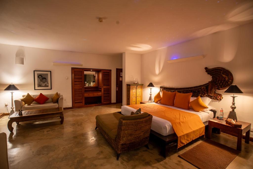 A bed or beds in a room at Aditya Resort