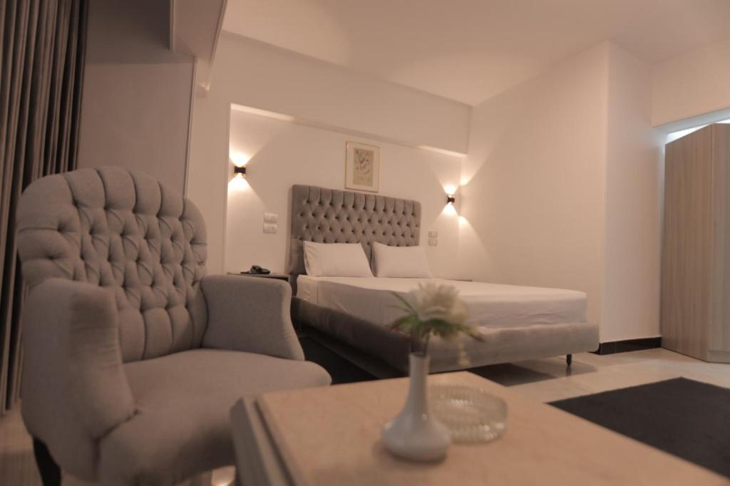 Postel nebo postele na pokoji v ubytování Aura Inn Hotel Cairo