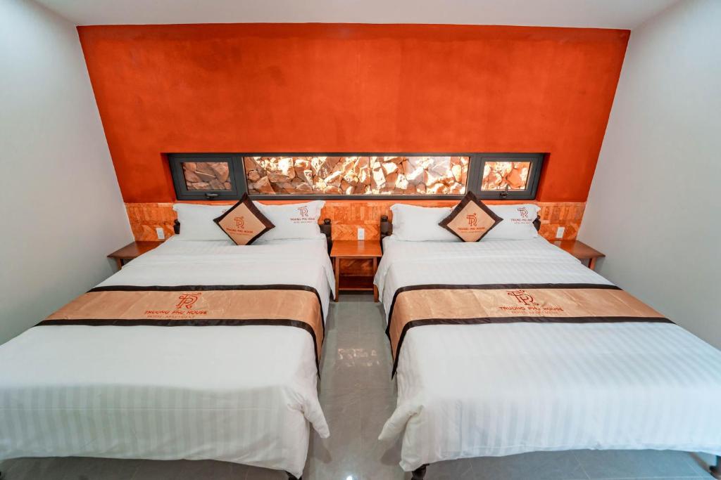 Giường trong phòng chung tại TRUONG PHU HOUSE - HOTEL & APARTMENT
