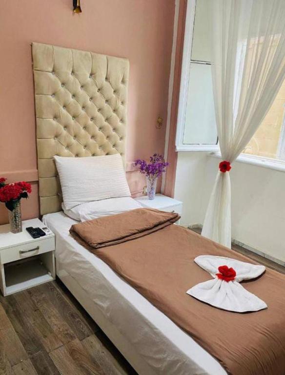 Postel nebo postele na pokoji v ubytování New Palace