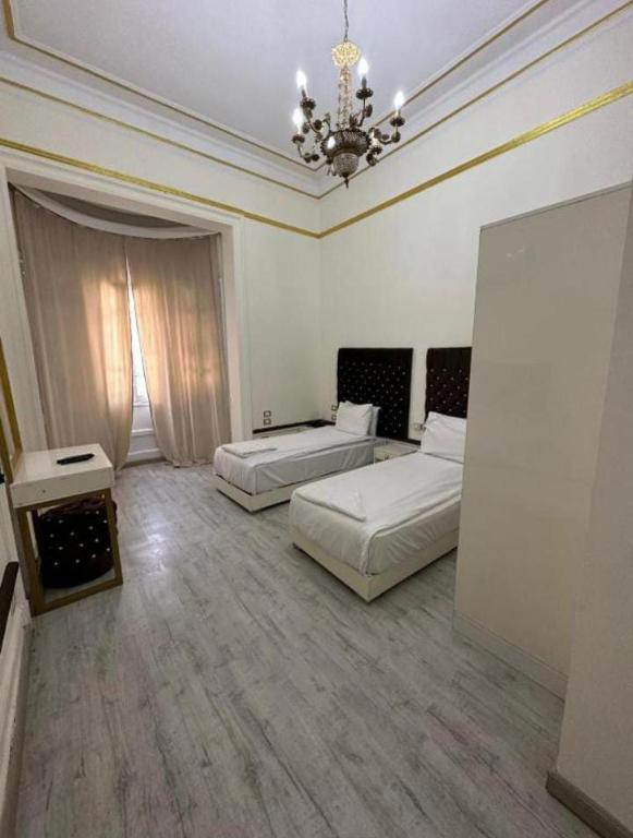 Postel nebo postele na pokoji v ubytování New Palace