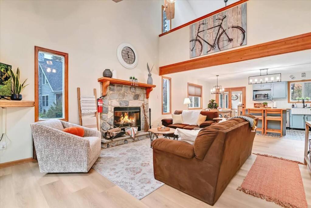 a living room with a couch and a fireplace at Rustic Modern Retreat in Poconos in Albrightsville