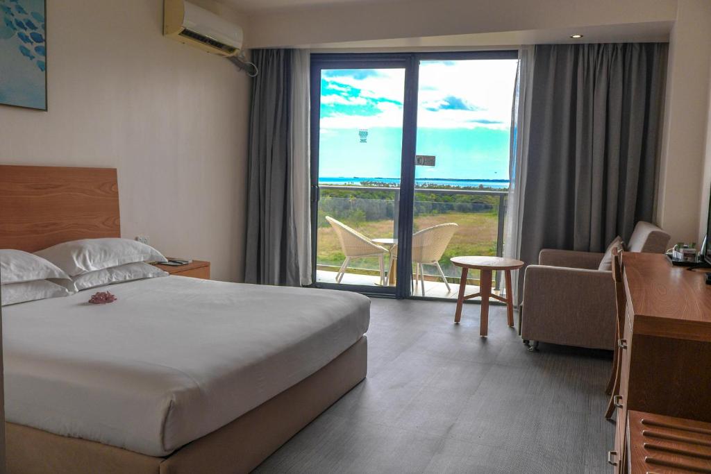 Rúm í herbergi á Nalagi Hotel