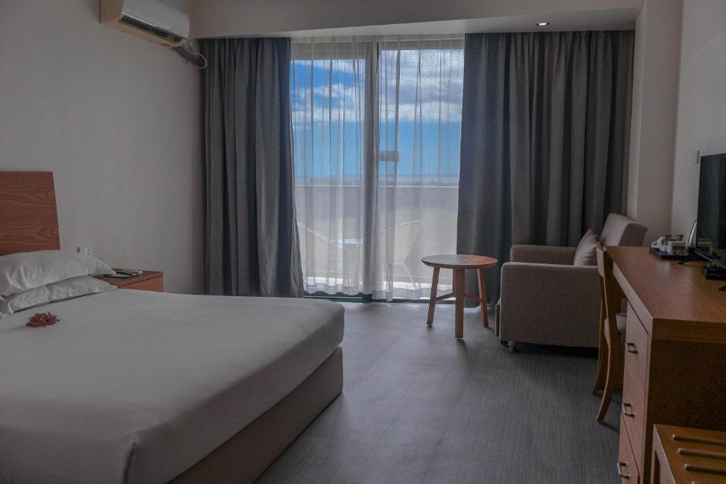 Rúm í herbergi á Nalagi Hotel