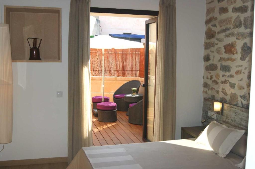 Postel nebo postele na pokoji v ubytování Petit Hotel C'an Mel