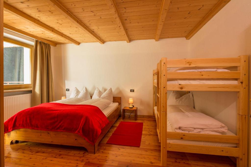 Postel nebo postele na pokoji v ubytování Stelvio Residence
