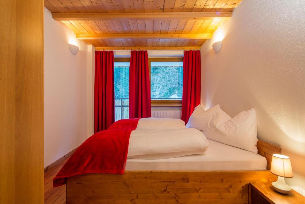 Postel nebo postele na pokoji v ubytování Stelvio Residence