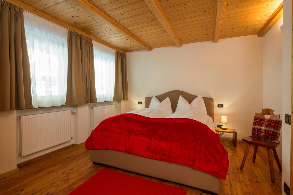 Postel nebo postele na pokoji v ubytování Stelvio Residence