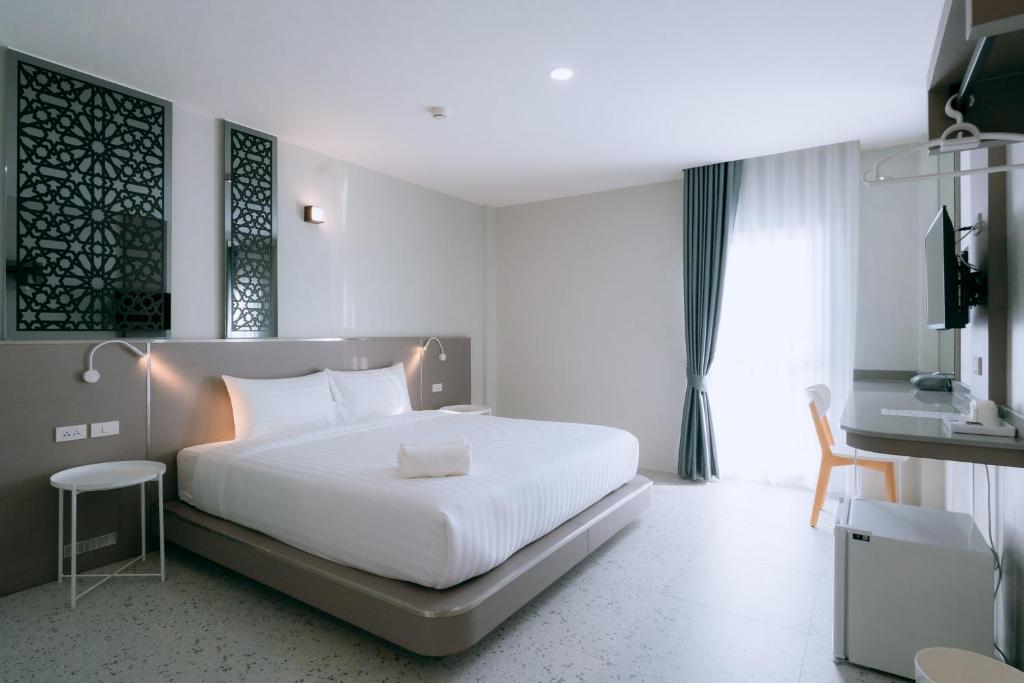 Postel nebo postele na pokoji v ubytování วัน บัดเจท เชียงราย บายพาสตะวันออก One Budget Hotel Chiangrai Bypass-East