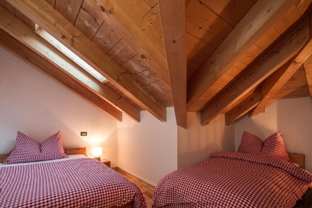 Postel nebo postele na pokoji v ubytování Stelvio Residence